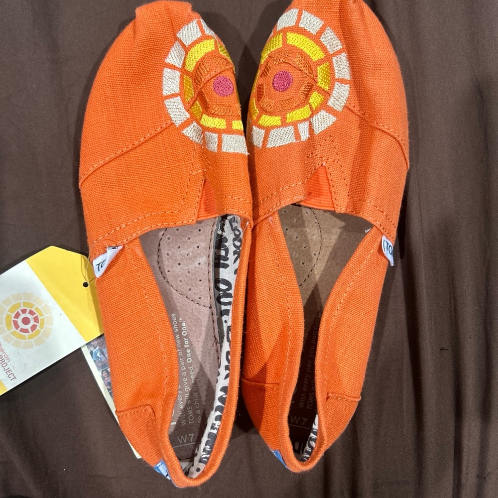 Toms Vibrant Orange Flats with Artistic Pattern